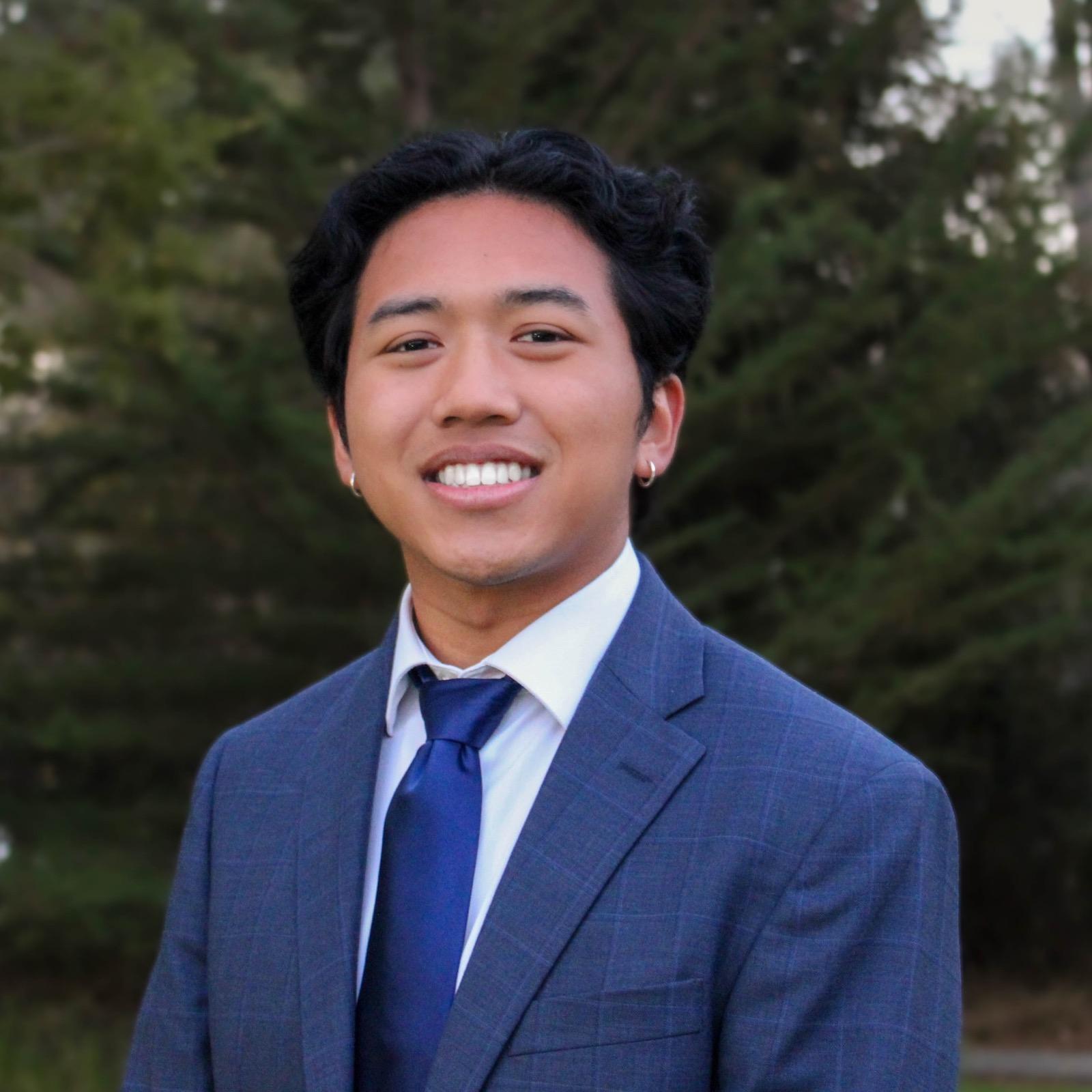 Shafiq Amat in a suit outdoors
