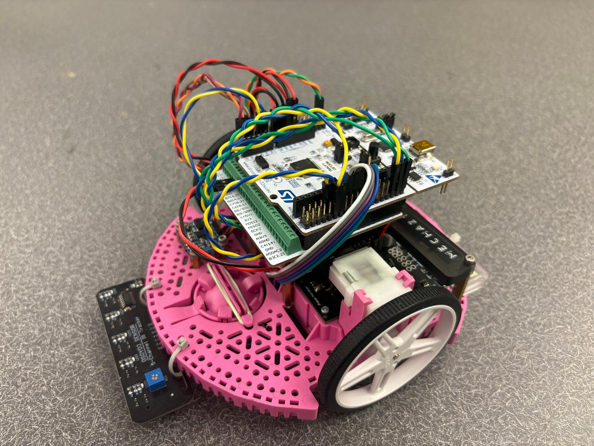 Pink Romi robot with an STM32 controller and sensors